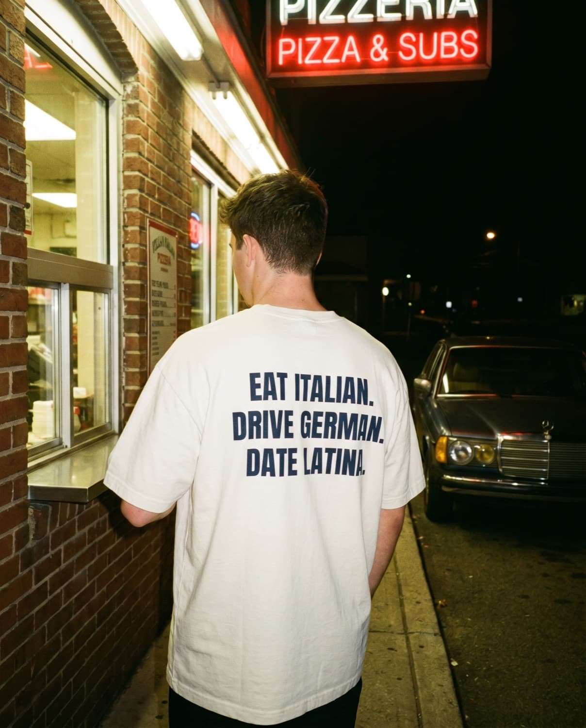 Back view of the "EAT ITALIAN. DRIVE GERMAN. DATE LATINA." tee