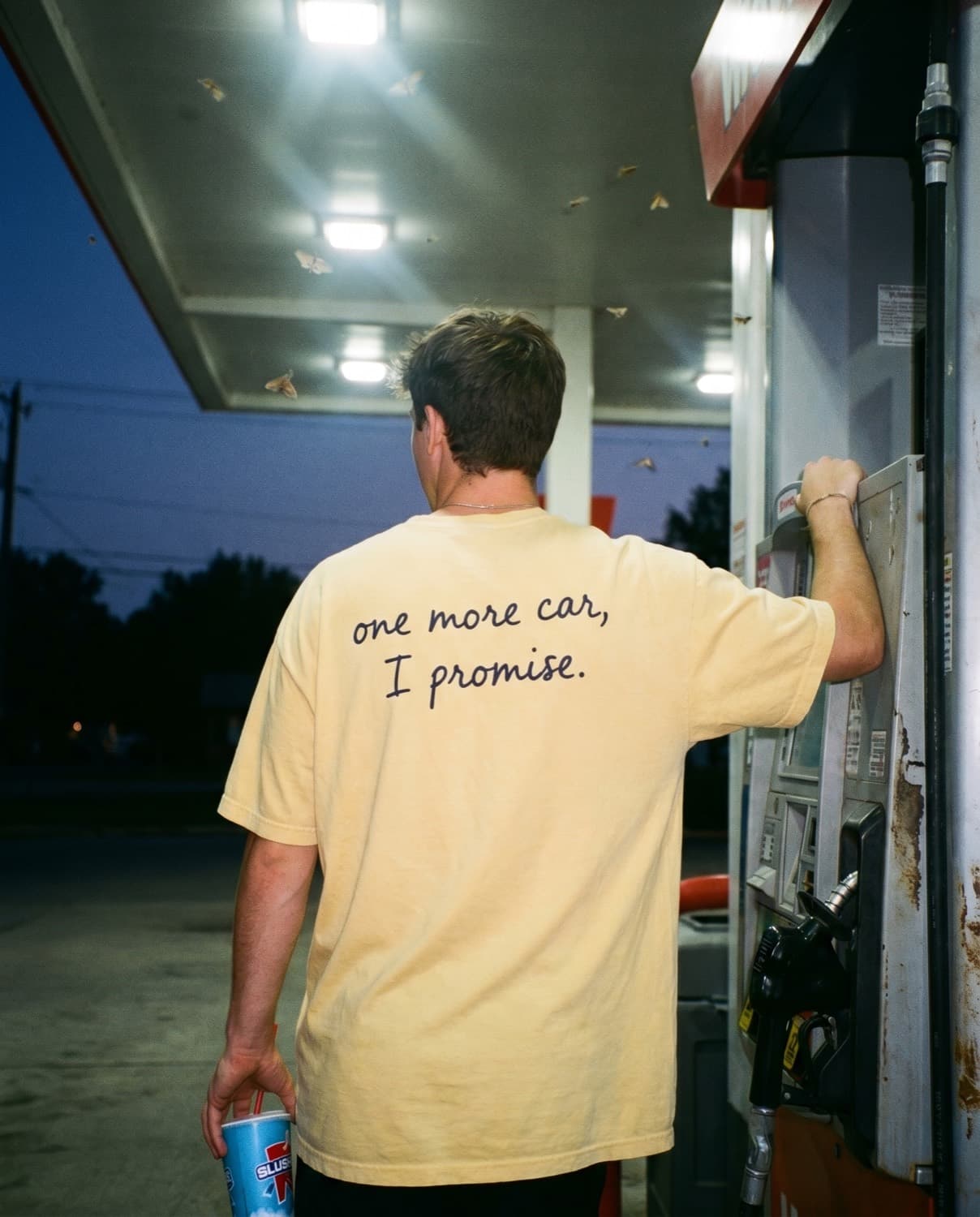 Back view of the "one more car, I promise." tee